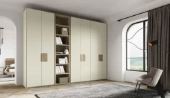 Armadio con ante battenti a prezzo scontato modello Armadio con libreria centrale colore perla opaco di dalcin in promo-sconto del 50% di Dal cin