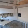 Cucina Stosa moderna ad angolo bianca in laminato materico Infinity